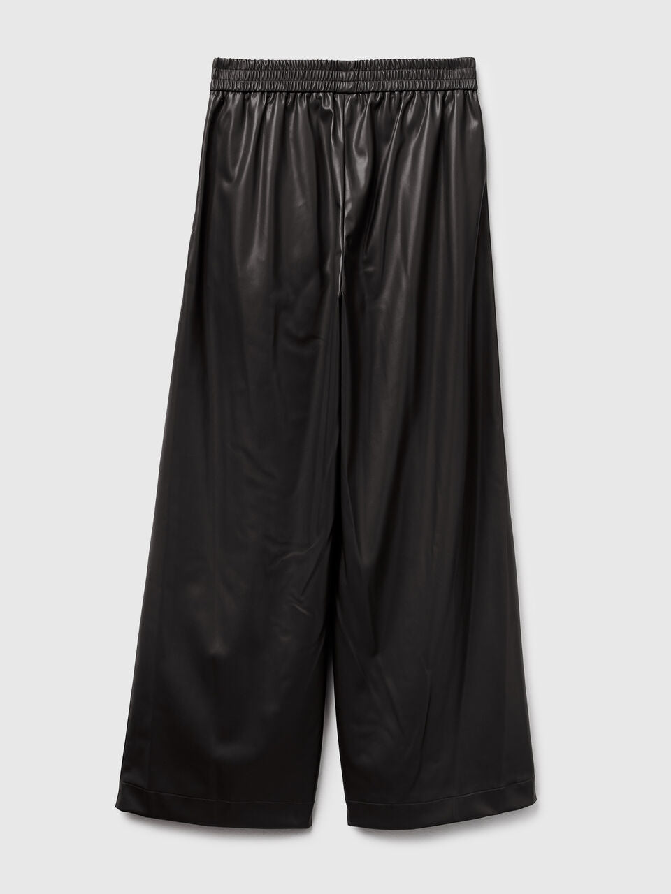TROUSERS IN IMITATION LEATHER FABRIC