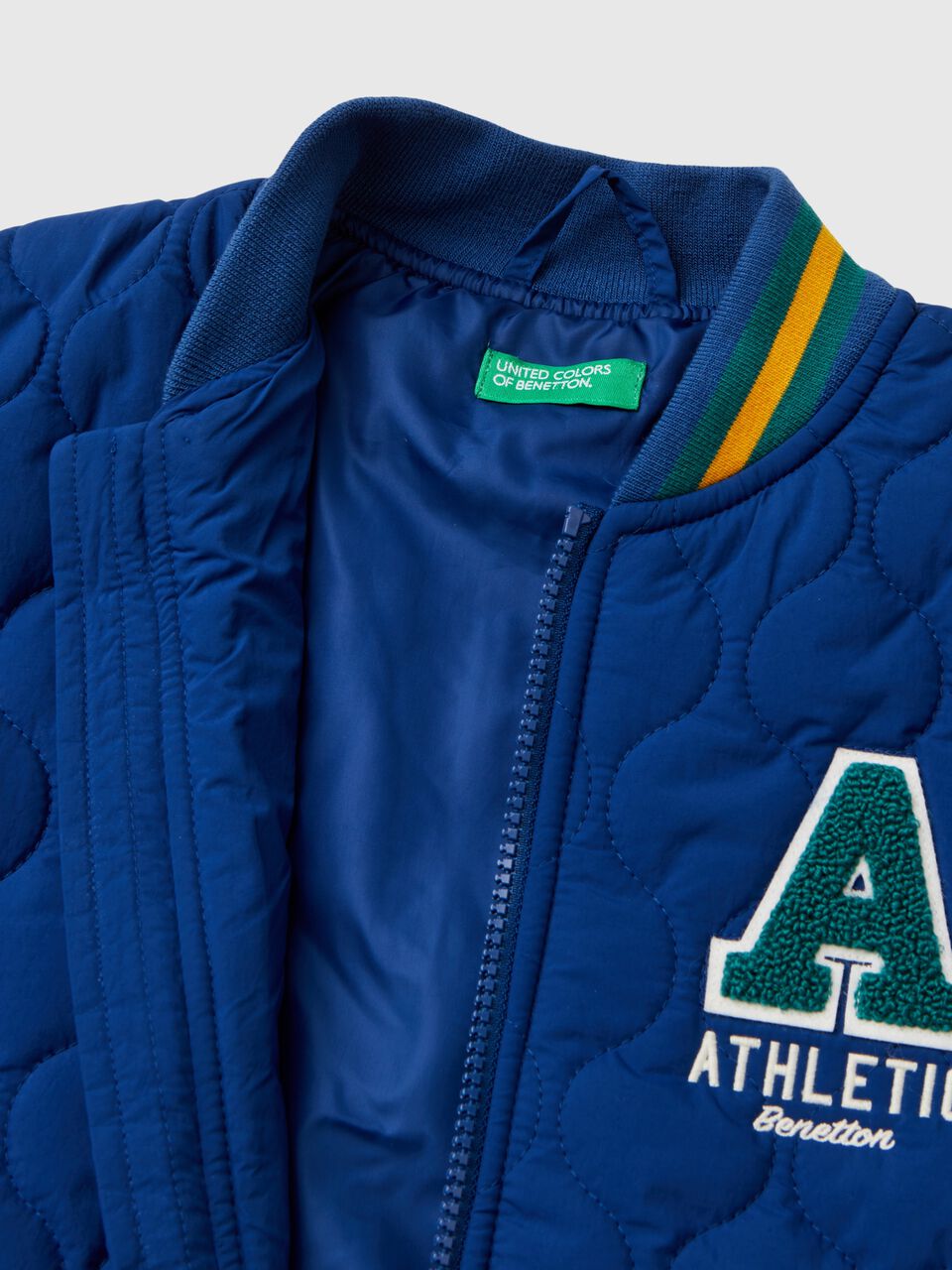 BOMBER JACKET WITH TARTAN SLEEVES