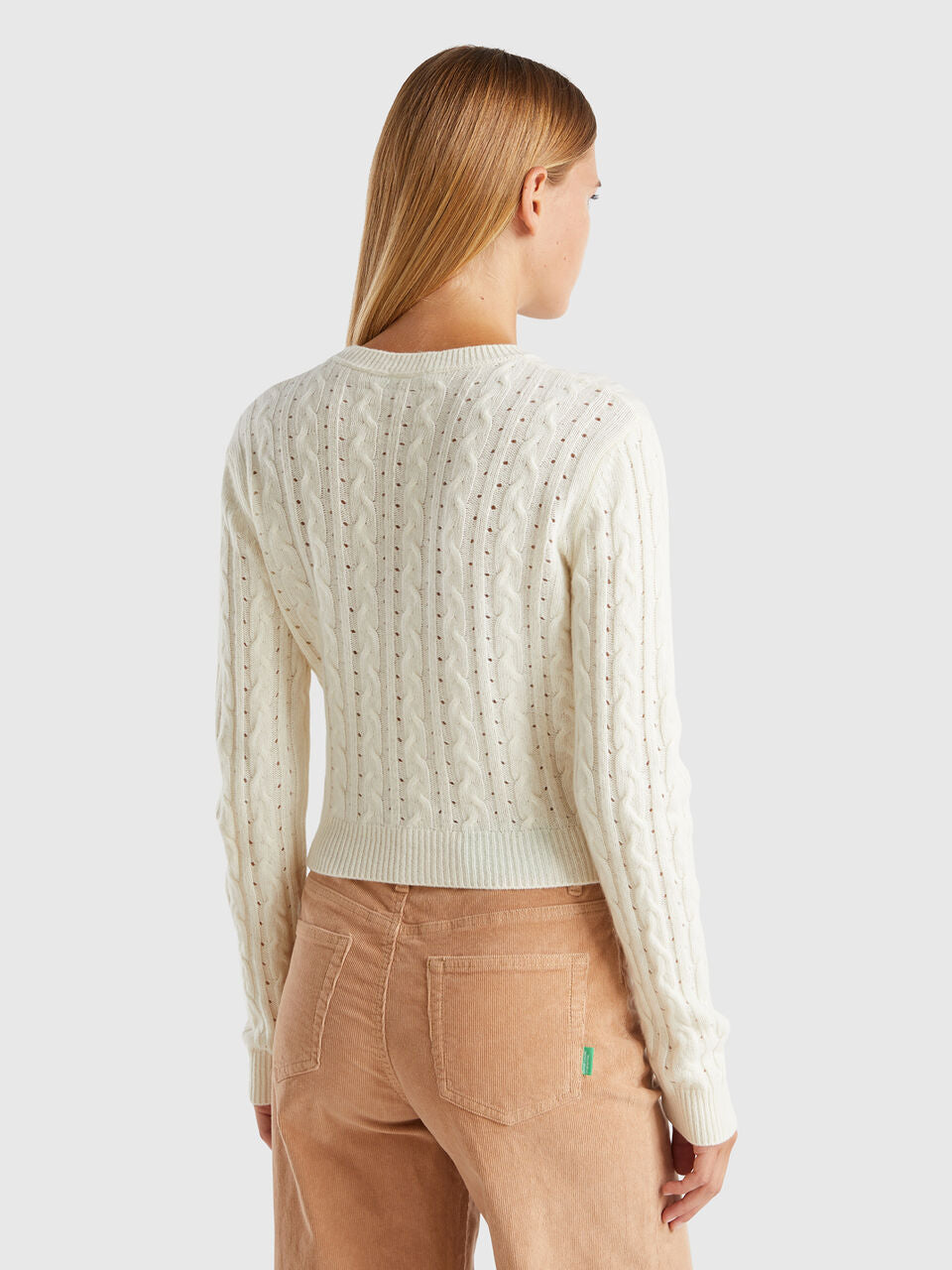 CROPPED SWEATER WITH CABLE KNIT AND PERFORATIONS