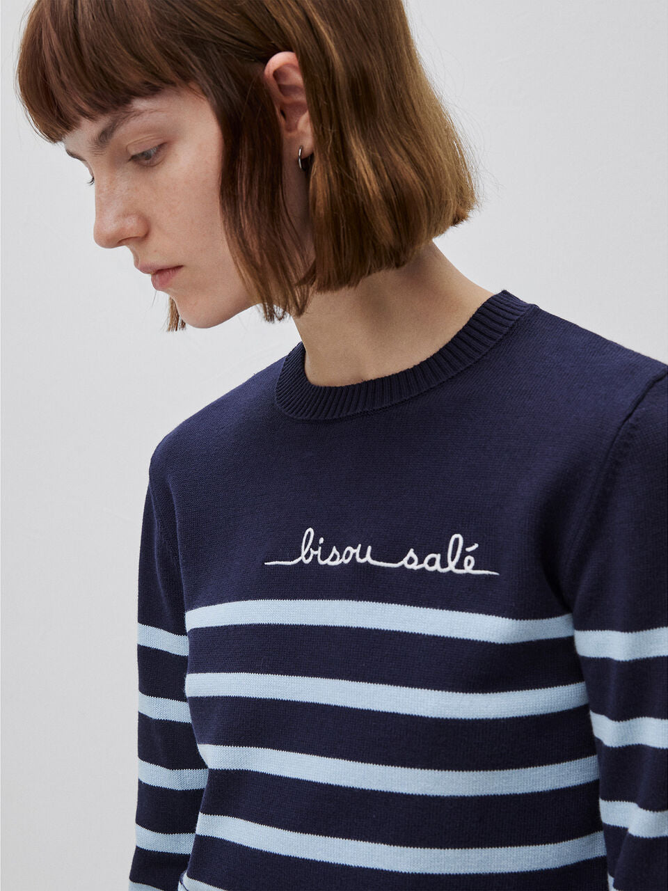 STRIPED SWEATER WITH EMBROIDERED WRITING